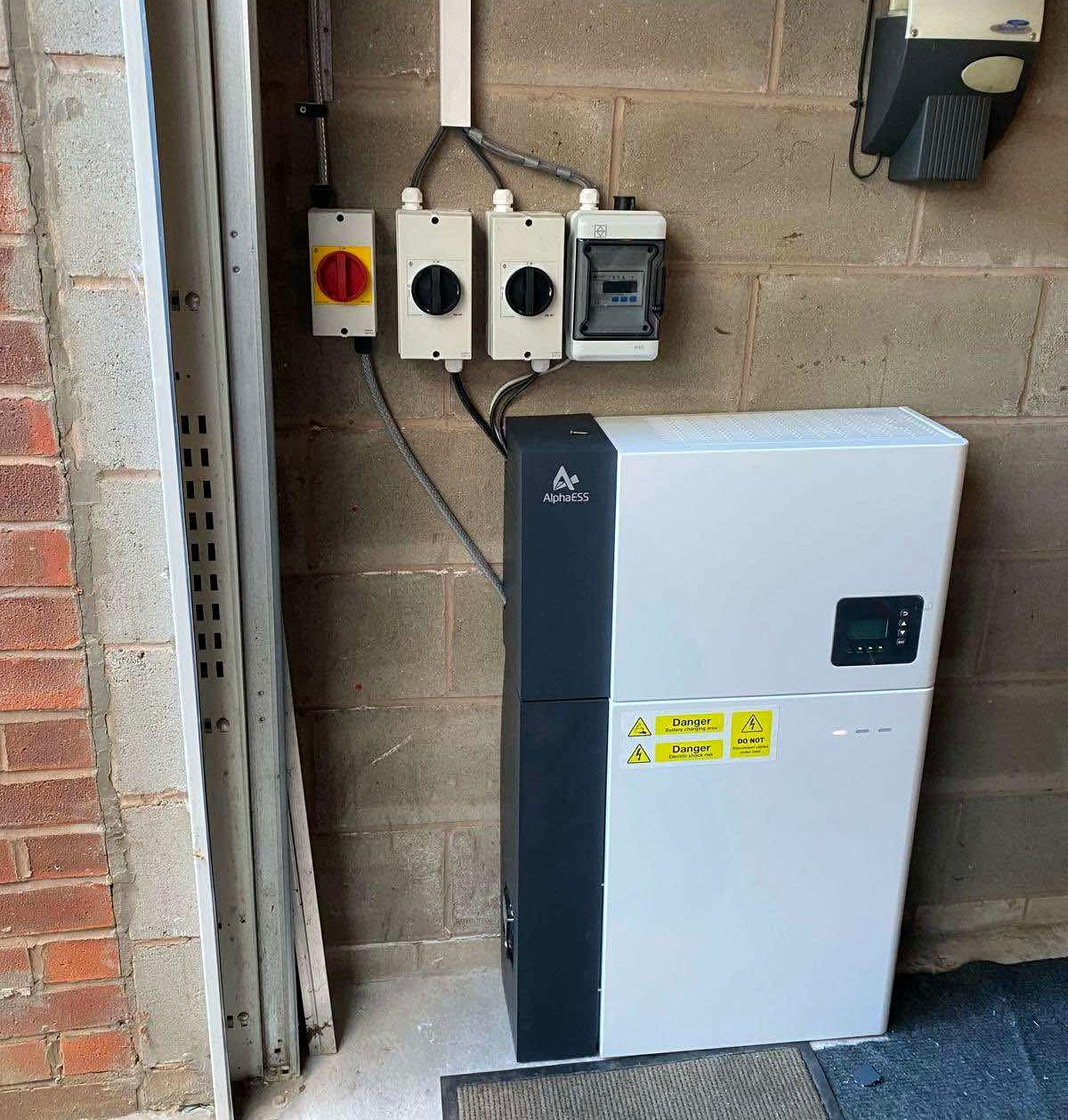 Alpha ESS battery and hybrid inverter installed in a garage